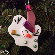 Load image into Gallery viewer, Adorable melted snowman fused glass ornament with purple hat with dichroic gold purple trim and green dichroic buttons #ornament