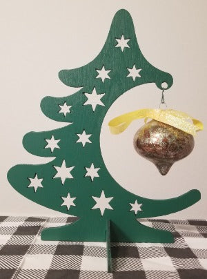 Wooden holiday tree bulb display. Holds one 3-4 inch bulb.  Wooden tree has 12 star cutouts. Bulb not included. 8x10x5 inches big.