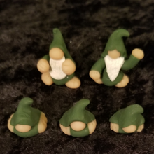 Load image into Gallery viewer, Miniature dark green baby gnome figurines, polymer clay, not a toy, mini figurine, tomte, gonk, gnomies, each figure is about 1 x 1 x .75 inches big
