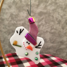 Load image into Gallery viewer, Adorable melted snowman fused glass ornament with purple hat with dichroic gold purple trim and green dichroic buttons #ornament
