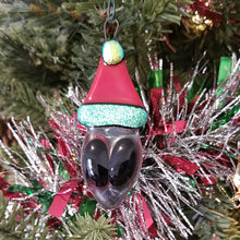 Load image into Gallery viewer, Fused glass Alien in a Santa hat ornament red green holiday bauble
