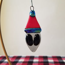 Load image into Gallery viewer, Festive Grey Alien in a Santa Hat fused glass ornament
