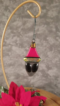 Load and play video in Gallery viewer, Fused Glass Gray Alien Ornament in a Santa hat red gold
