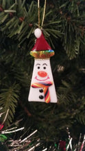 Load and play video in Gallery viewer, Cute snowman fused glass ornament with red hat with dichroic rainbow trim red buttons and scarf#ornament
