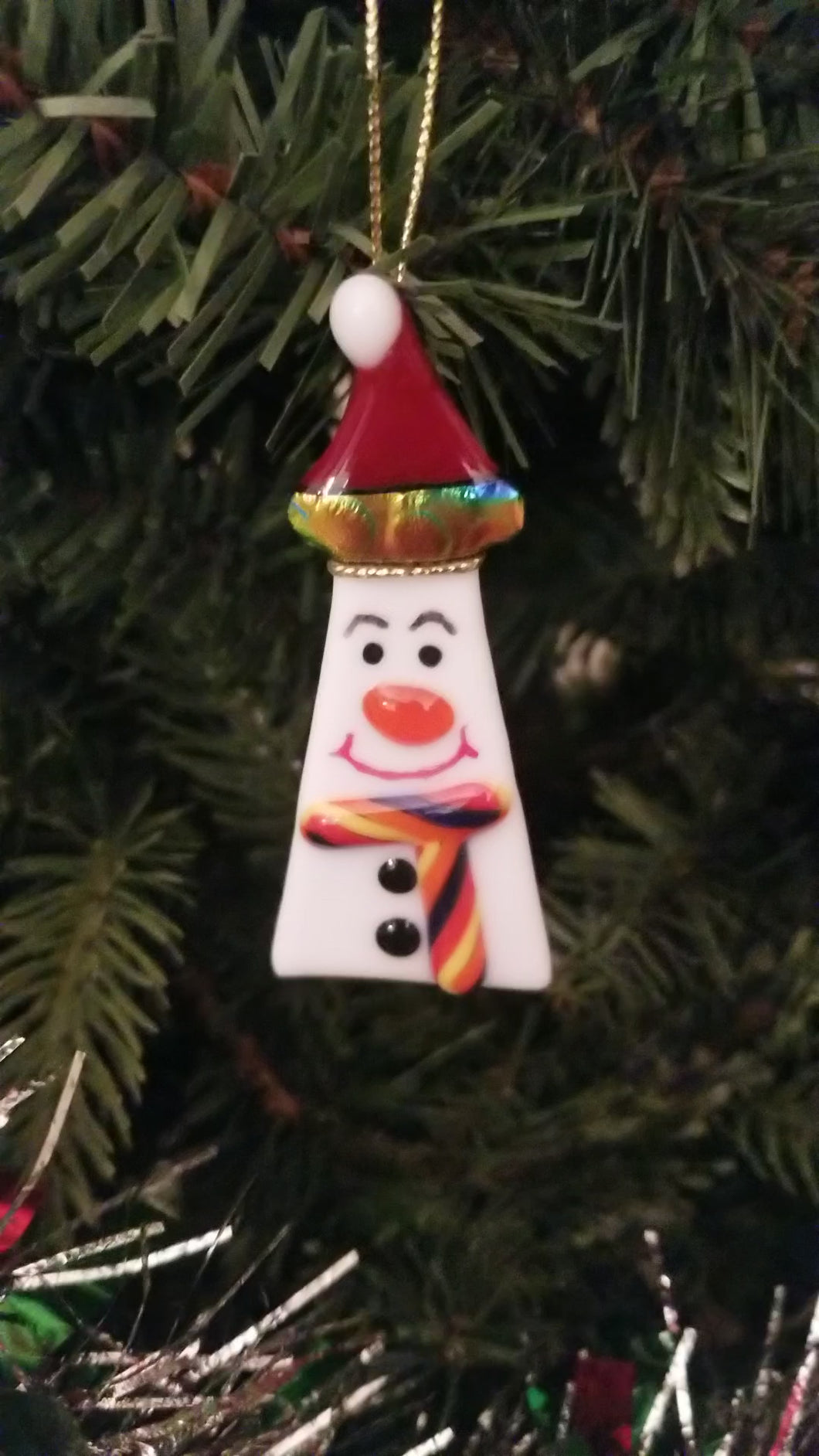 Cute snowman fused glass ornament with red hat with dichroic rainbow trim red buttons and scarf#ornament